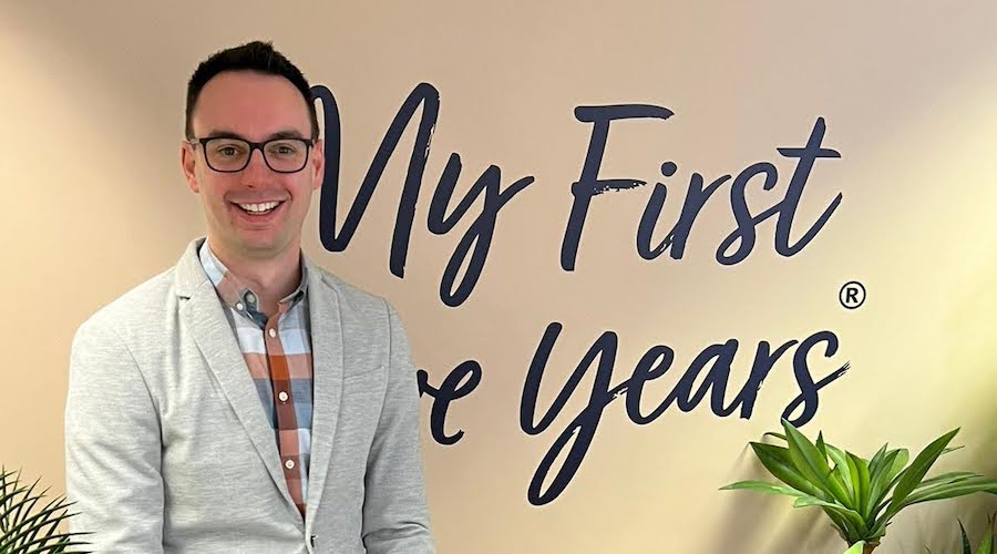 Andrew West-Moore against the My First Five Years logo