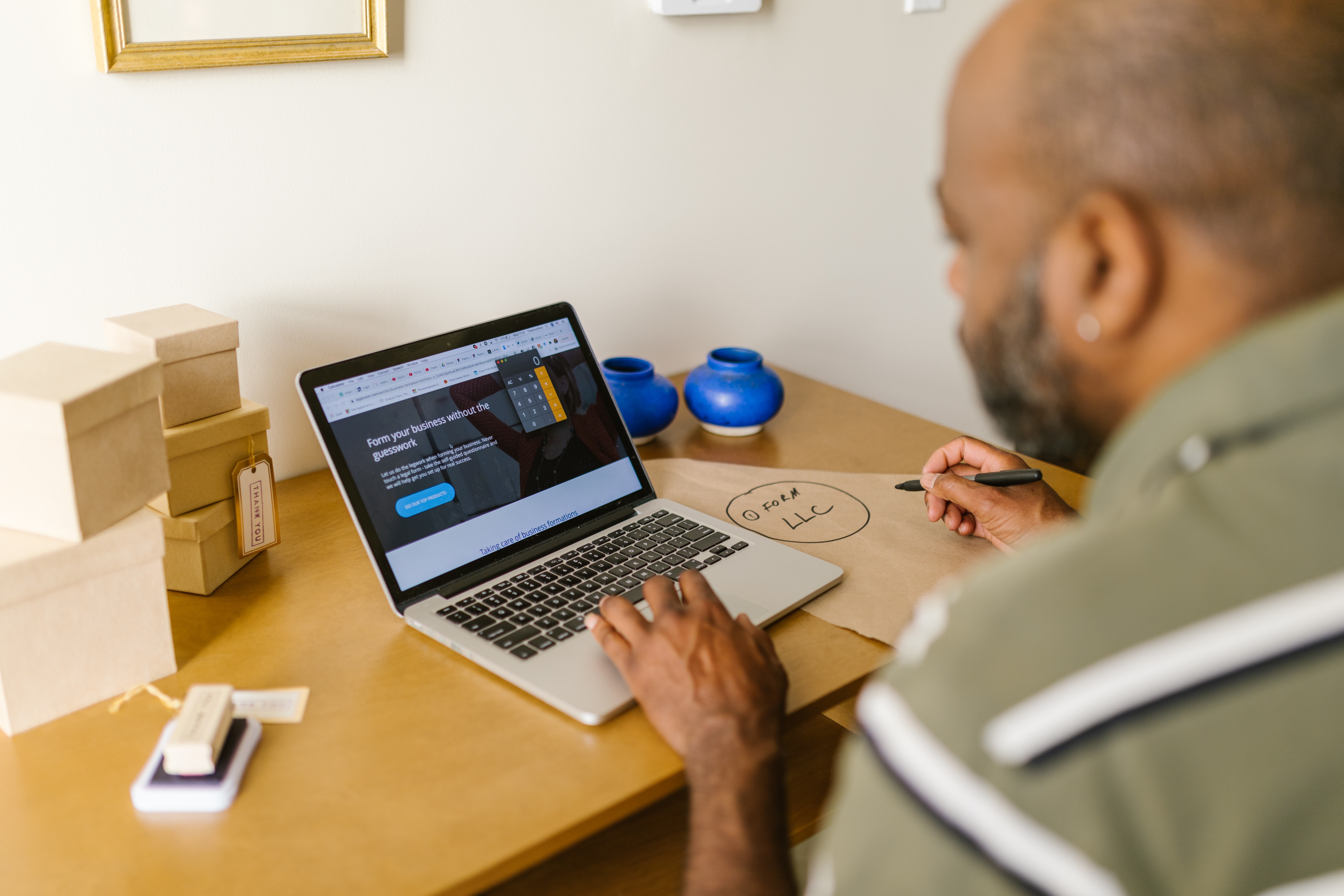 Man writing accessibility statement on laptop