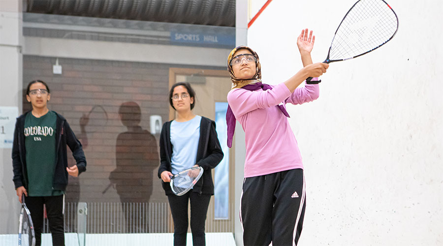 Teenage girls playing squash 57