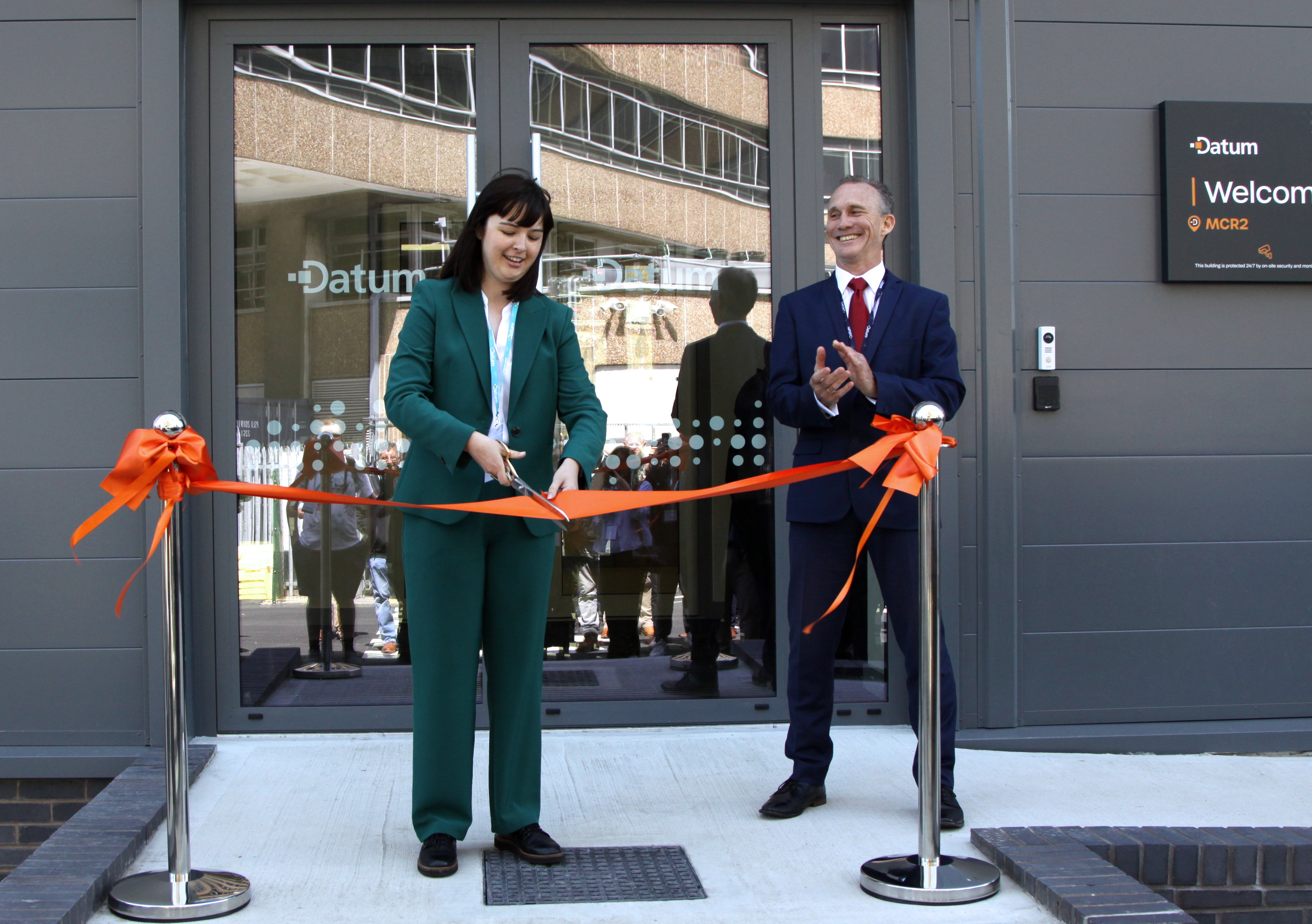 Councillor Emma Taylor, Labour Councillor for the Sharston Ward, cuts the ribbon outside MCR2 alongside Dominic Phillips (Datum CEO)