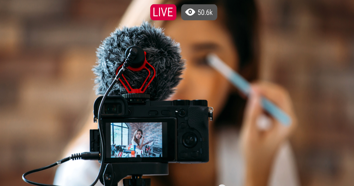 Camera filming influencer during a live broadcast with viewer count overlay