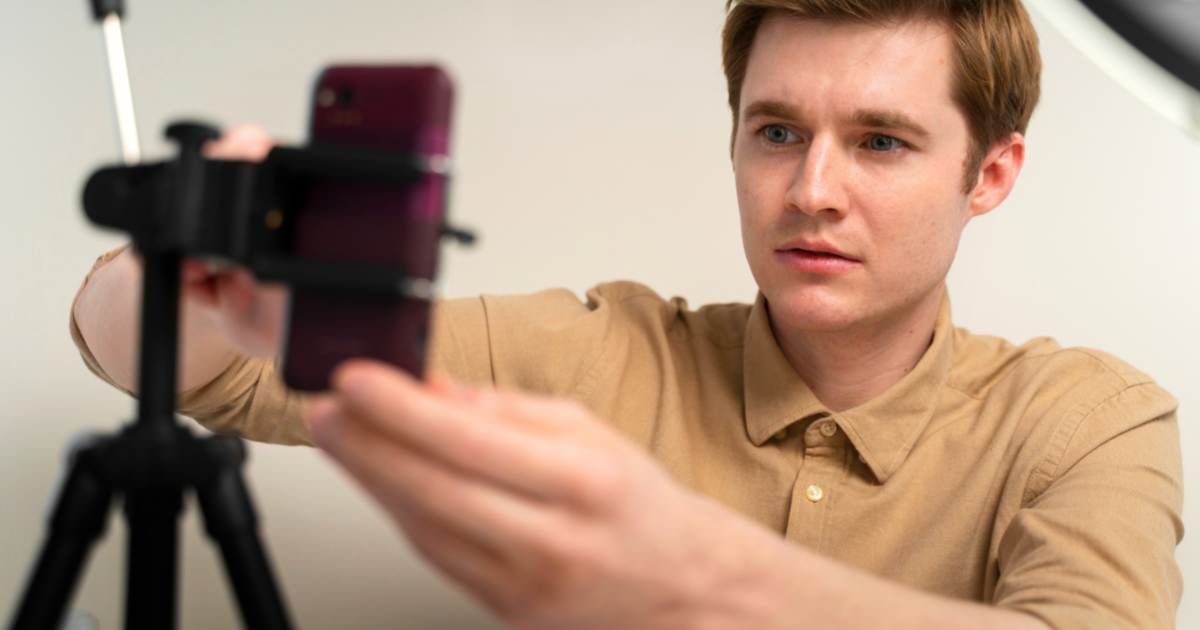Content creator setting up smartphone video production for social media marketing with support from Title Productions.