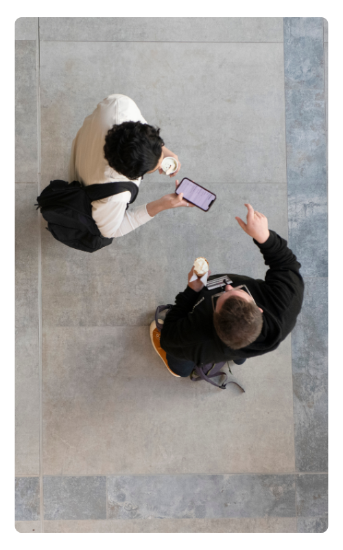 Two people greet each other from above