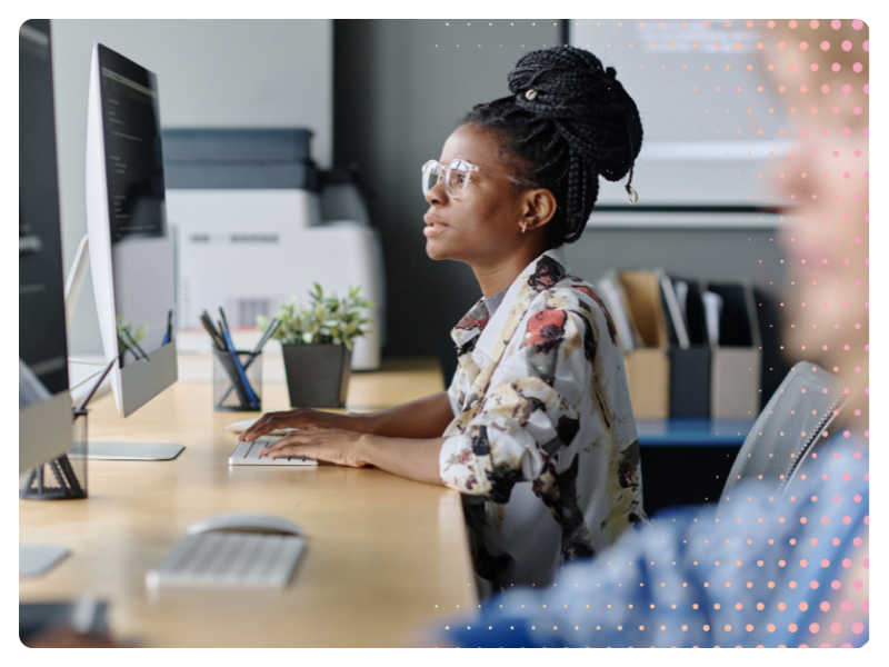 A woman works at a computer