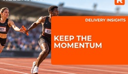 Relay runners handing over the baton to keep business momentum