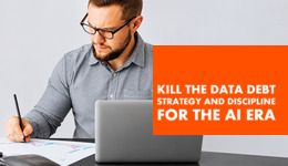 Relentica. Man working hard looking at data and holding a pen.