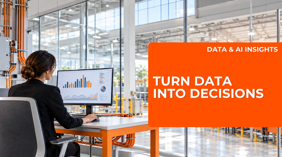 A woman reviewing business data in a bright modern factory office