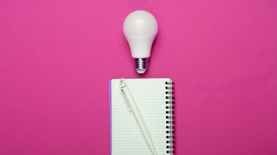 lightbulb and notepad with pen