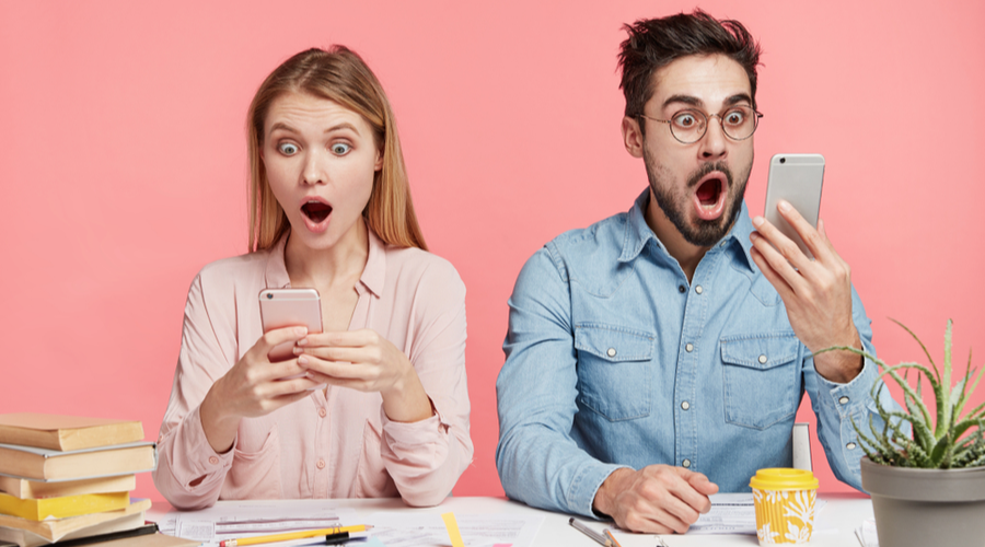 Shocked people on phone at desk